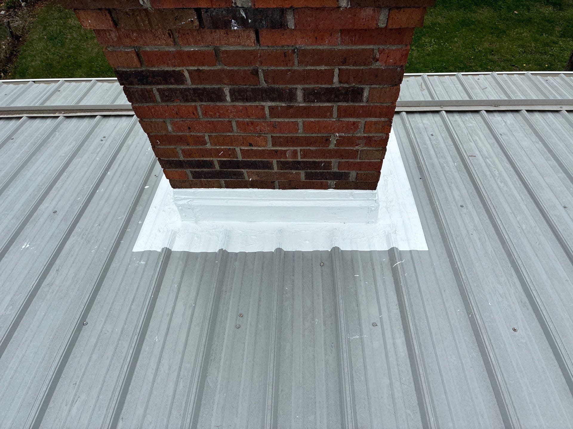 Chimney and Pipe Sealing on a Metal Roof Done Right image