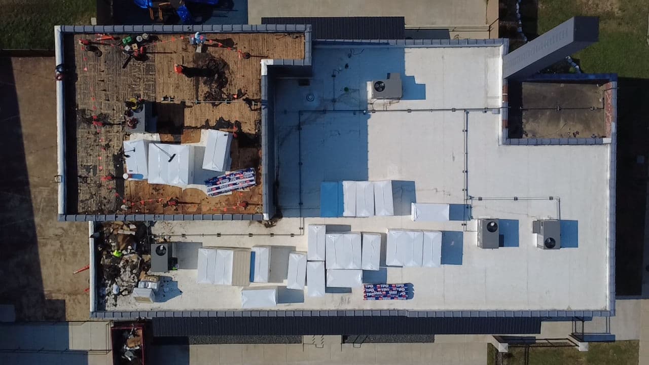 Large-Scale Commercial Flat Roof Replacement in Full Swing image